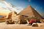 Camelo repousa perto de ruínas de entrada para pirâmide