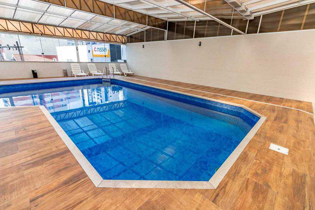 a swimming pool with a blue floor and blue walls 